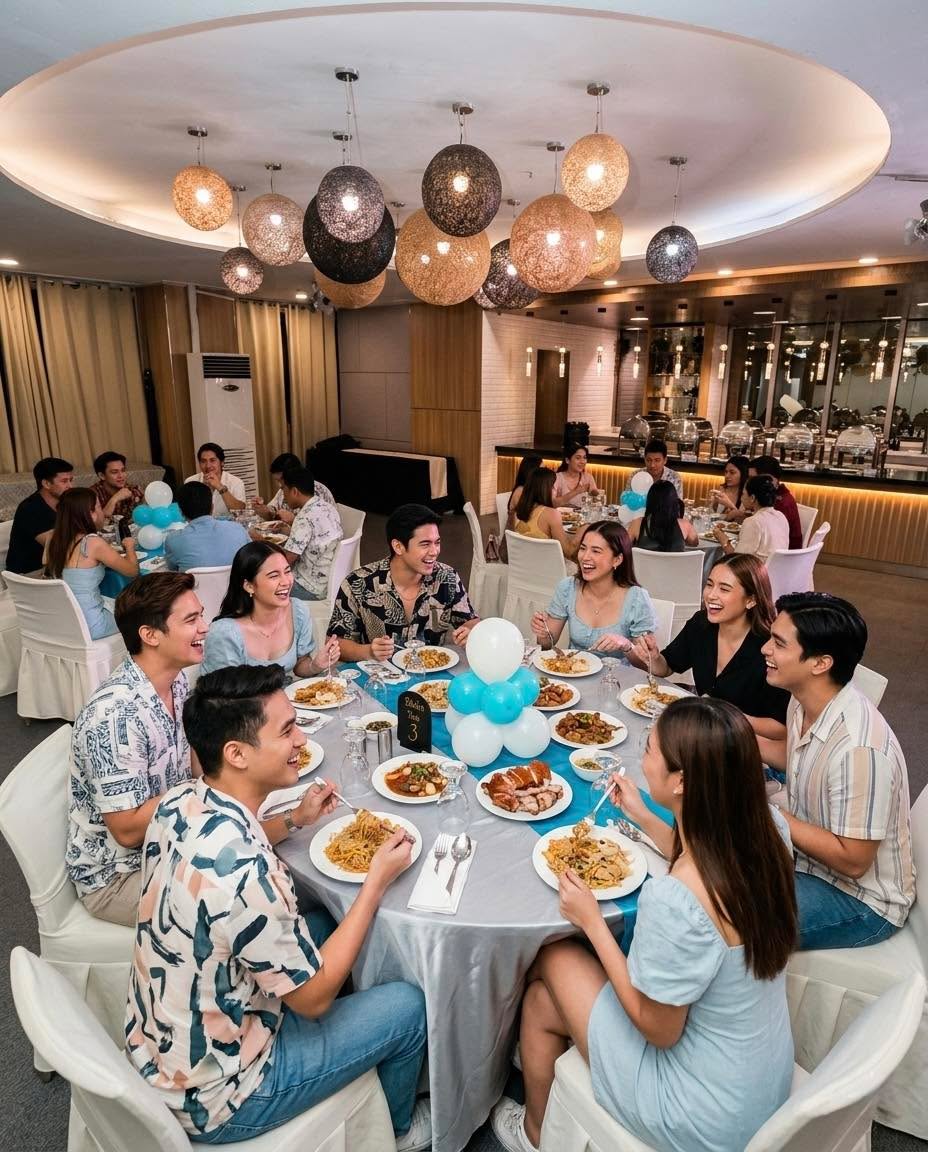 Guests dining at a round table inside Catering Trio PH function room
